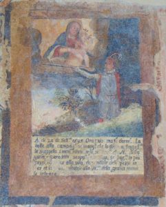 Antico affresco con la Madonna e il Bambino e una figura di frate